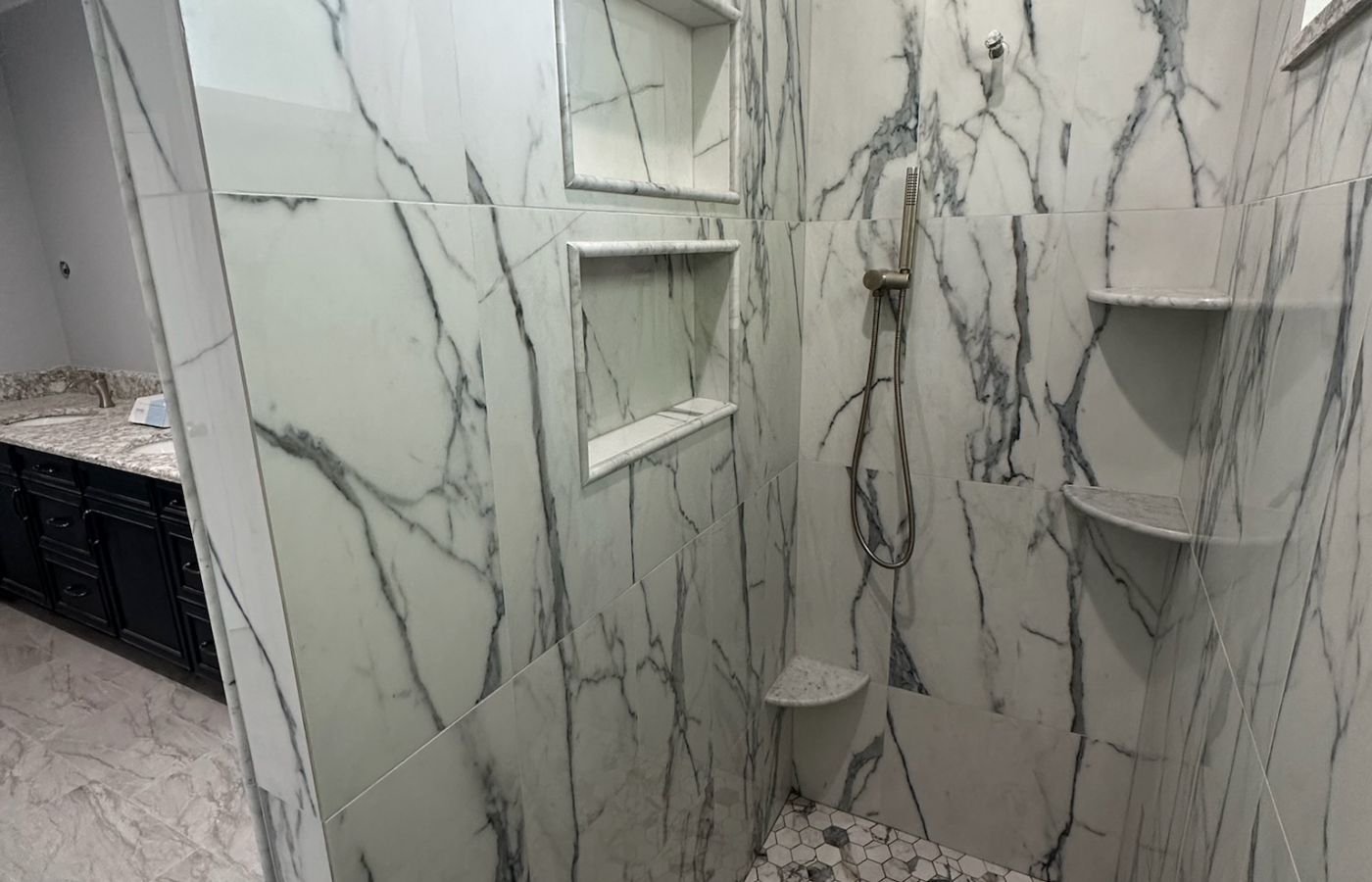 Marble Shower Framed by an Arched Window.