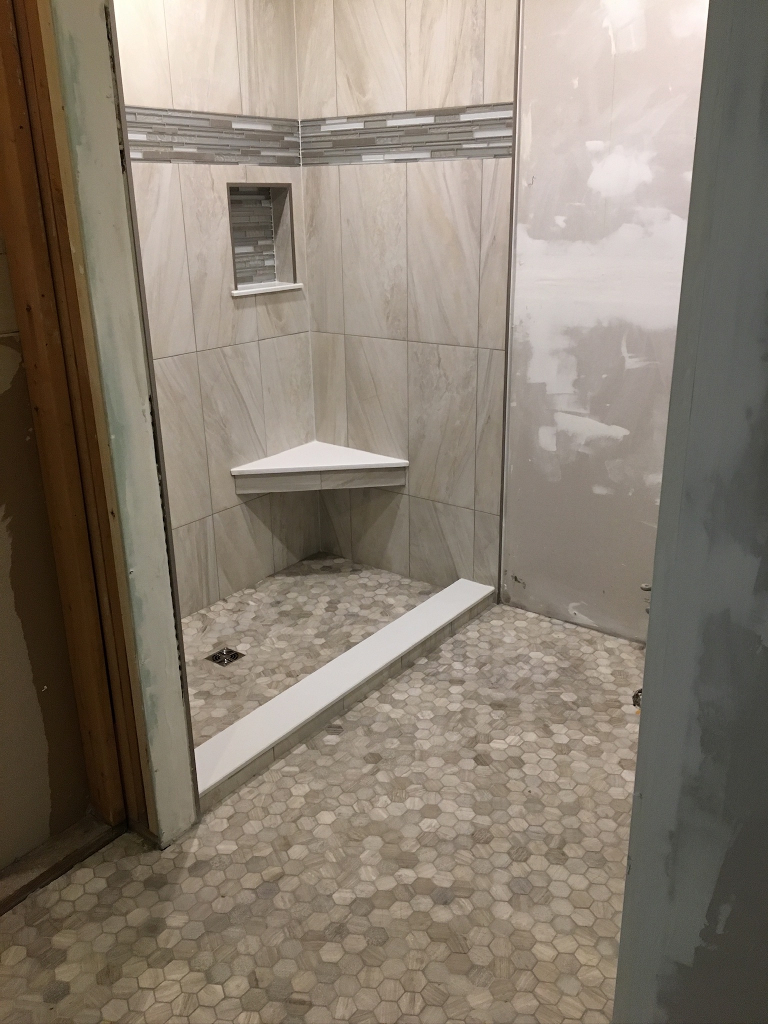 Mosaic Bathroom Floor with a Coordinated Shower Accent, project view 1.