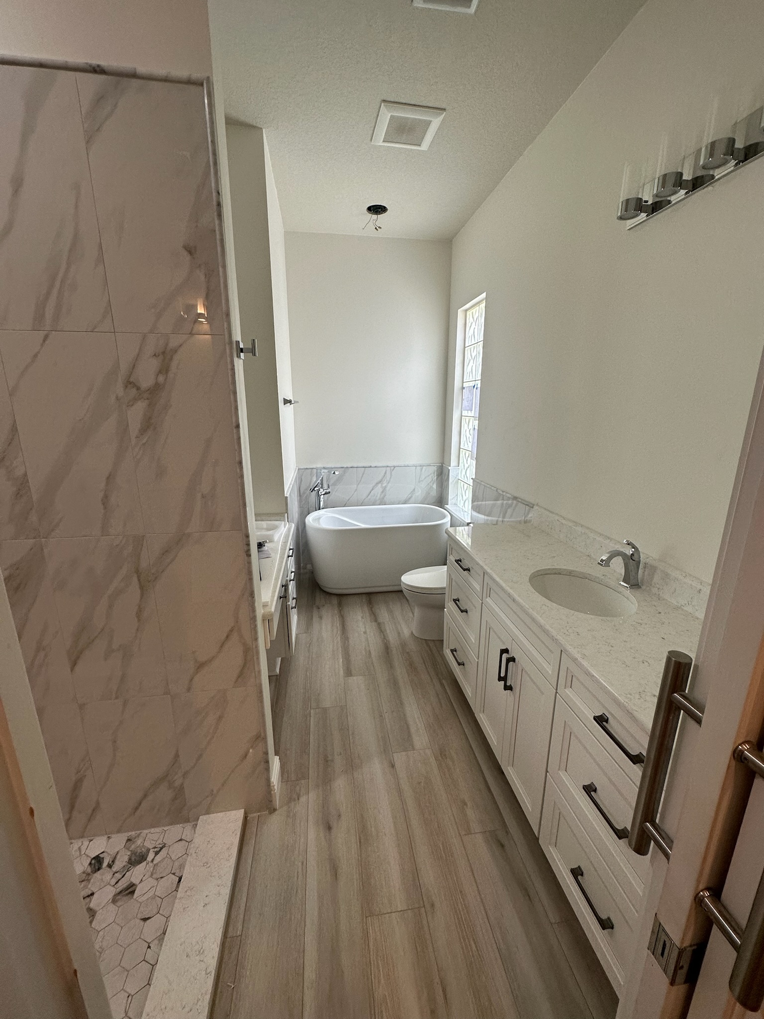 Marble Shower and Soaking Tub Retreat.
