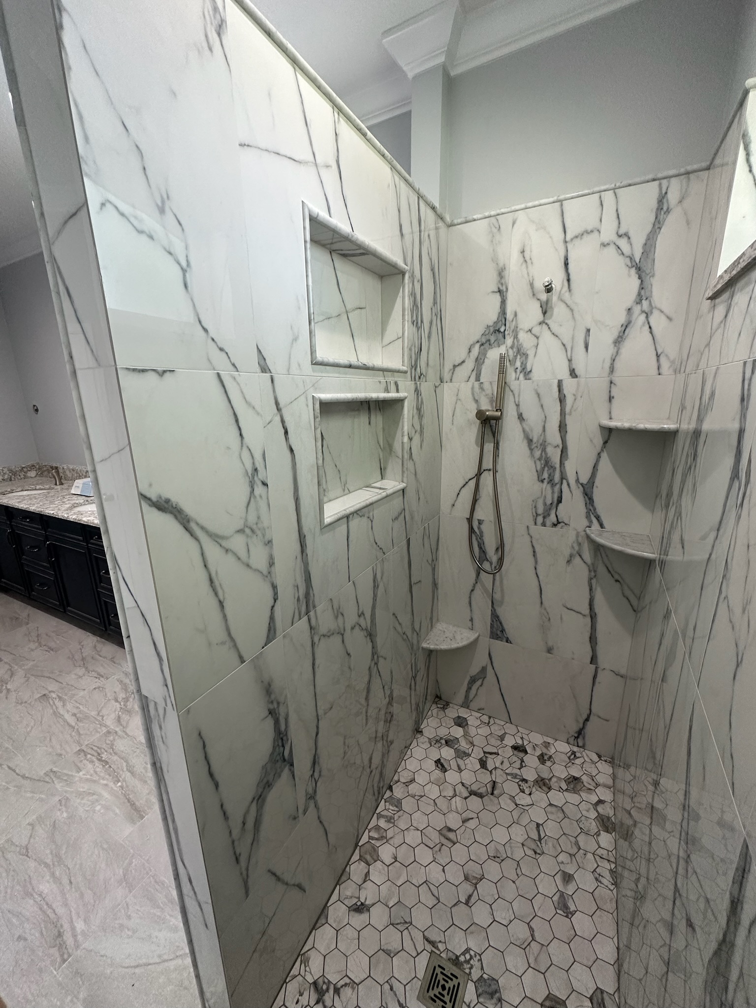 Marble Shower Framed by an Arched Window.