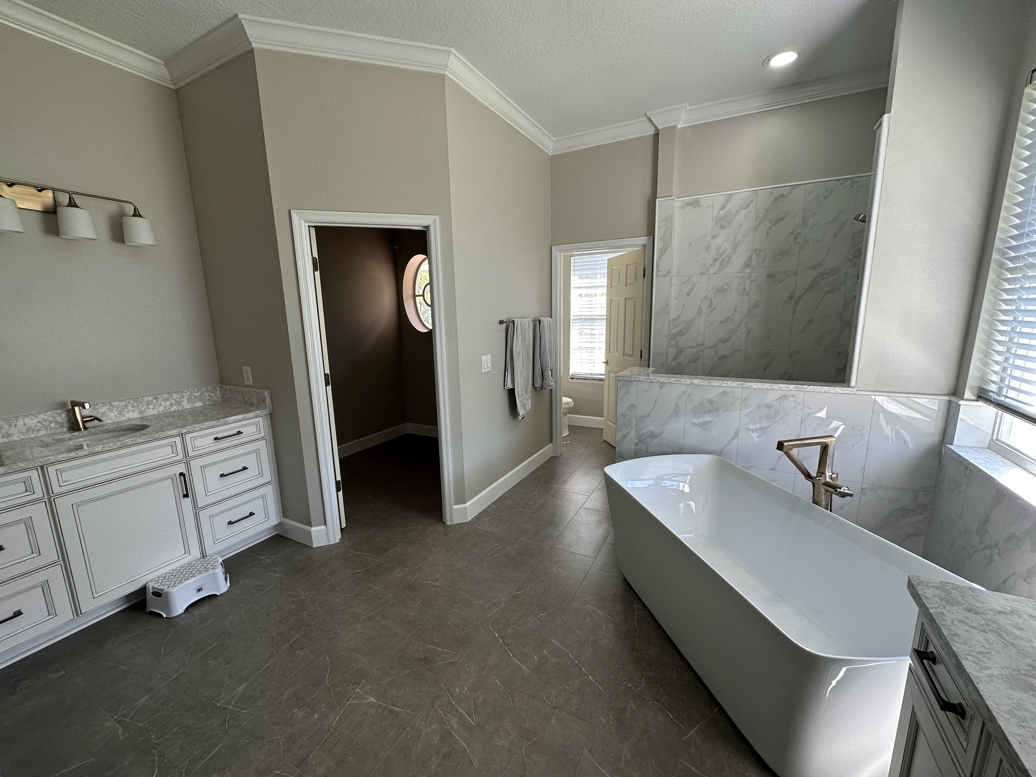 Dark Accent Shower with a Freestanding Tub.