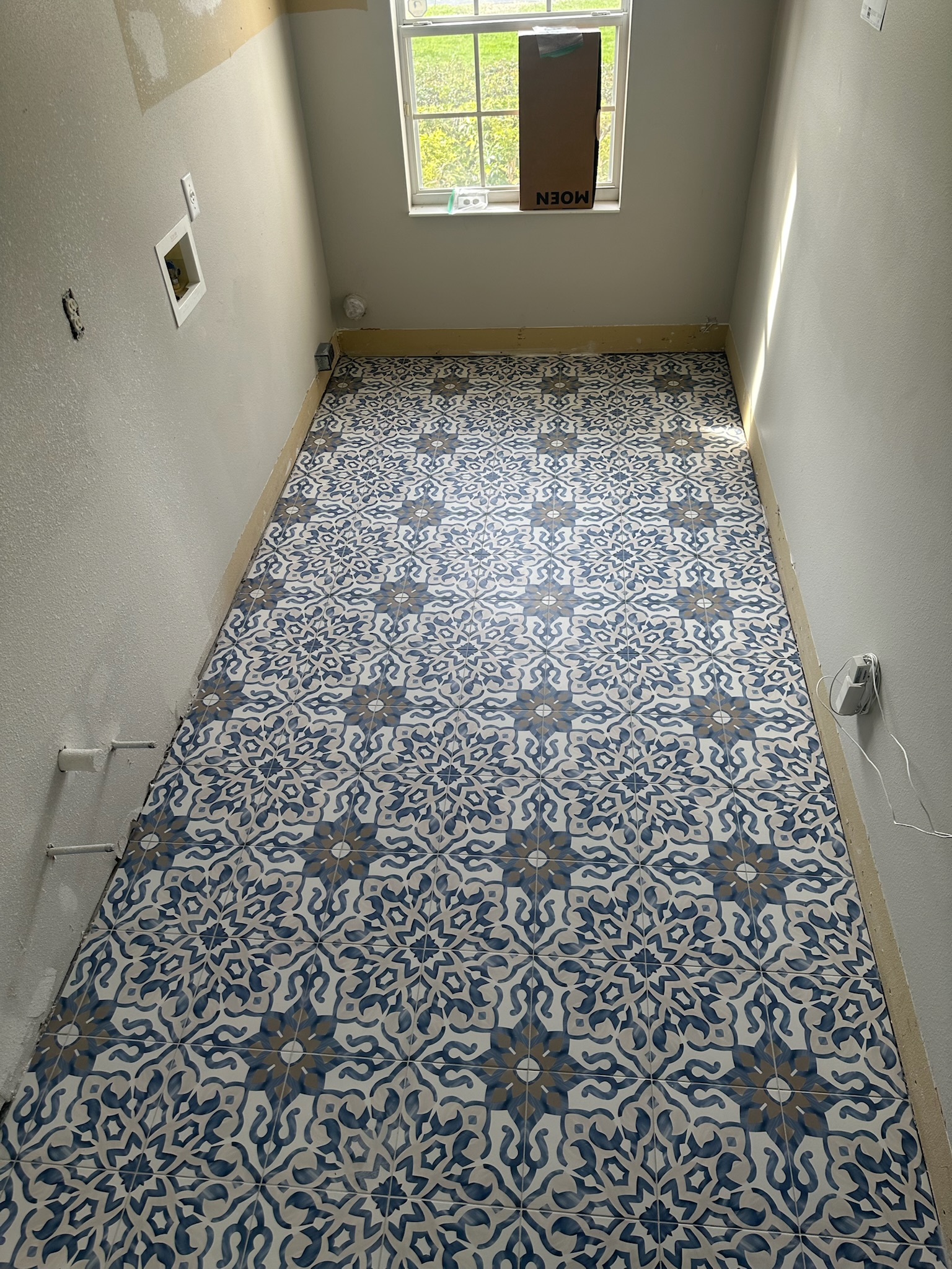 Patterned Tile Flooring Adds Character to a Bathroom.