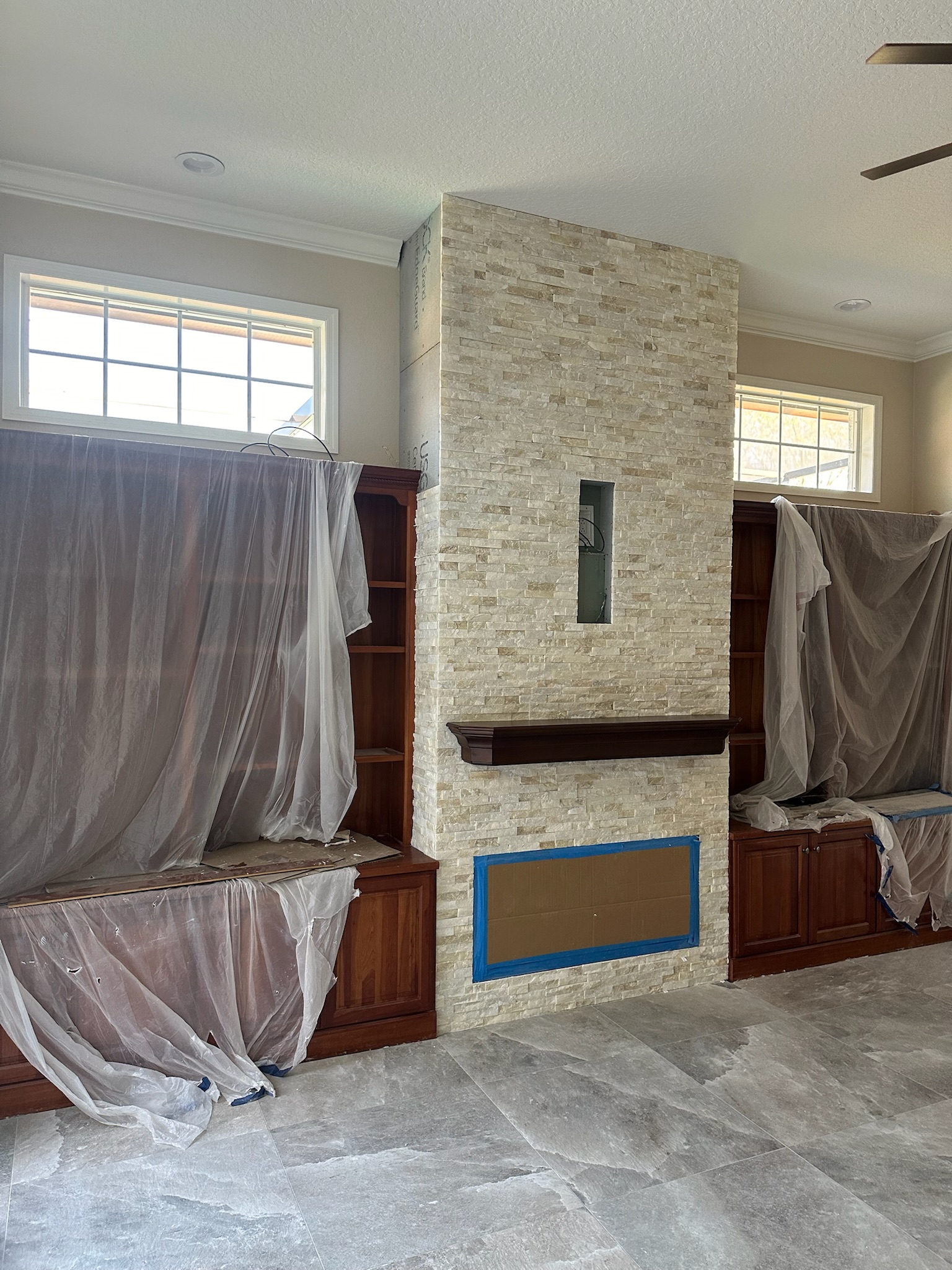 White Stacked Stone Fireplace with Built-In Shelving, project view 5.