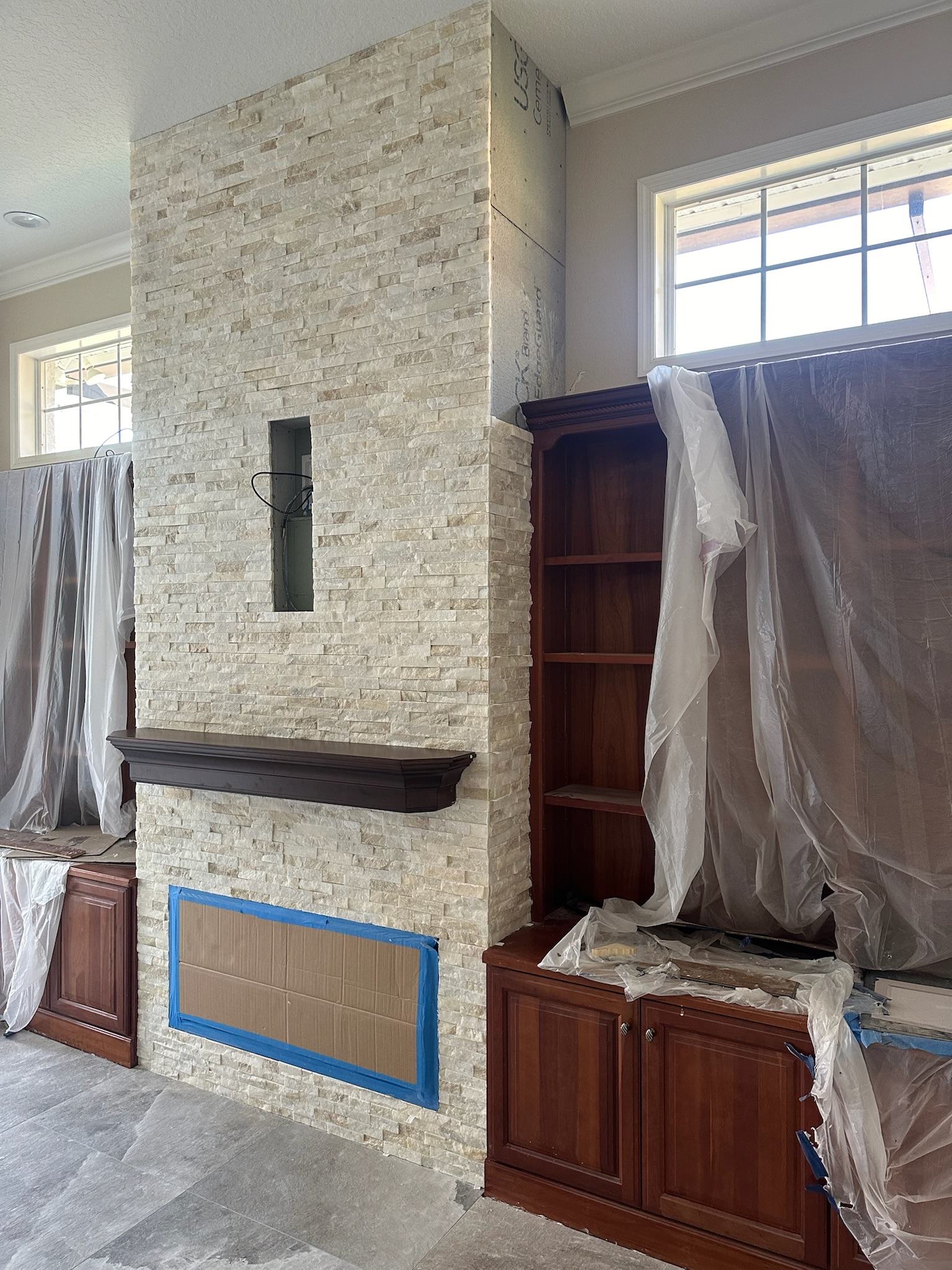 White Stacked Stone Fireplace with Built-In Shelving, project view 4.