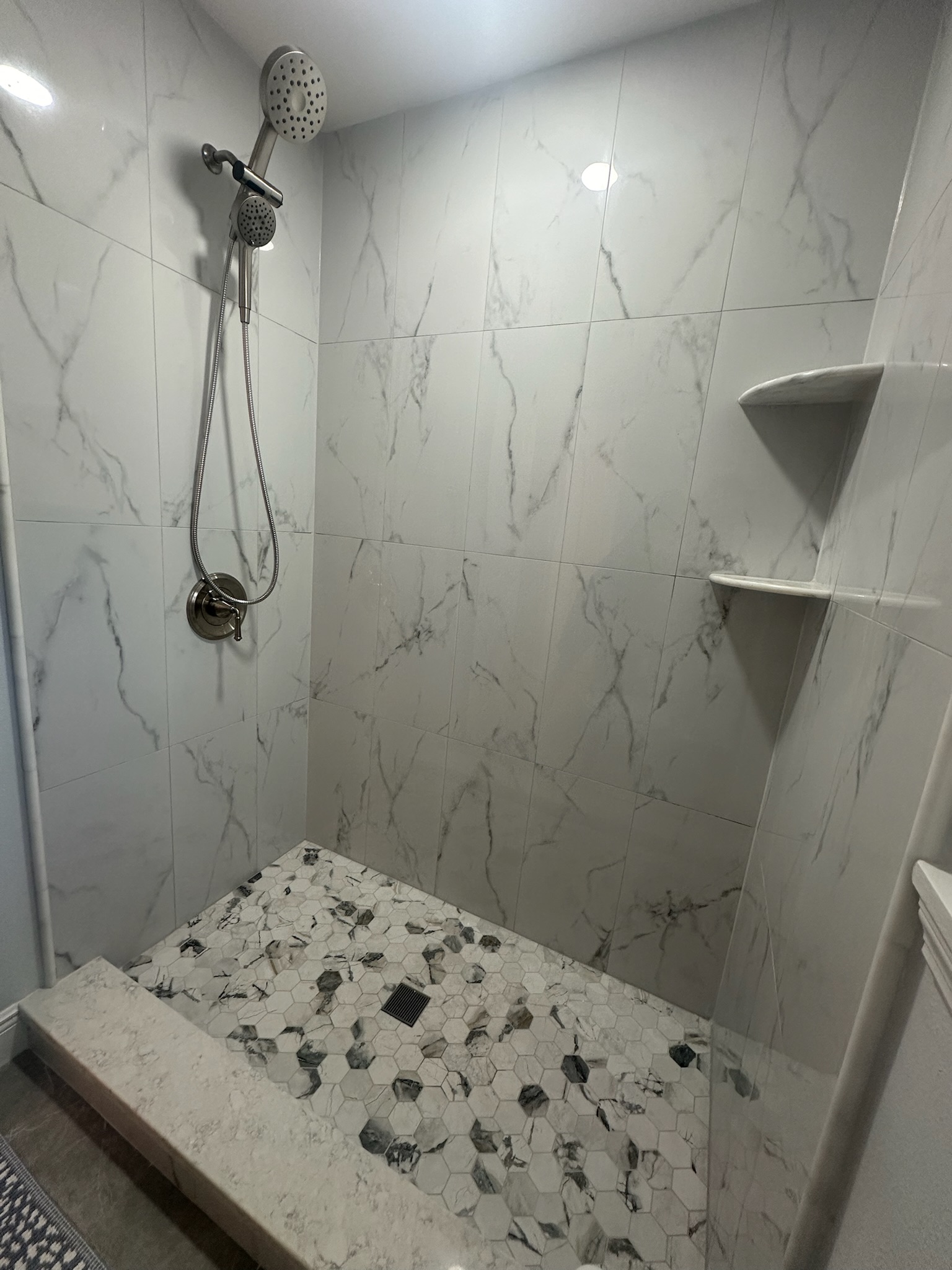 Freestanding Tub and Gray Mosaic Walk-In Shower.