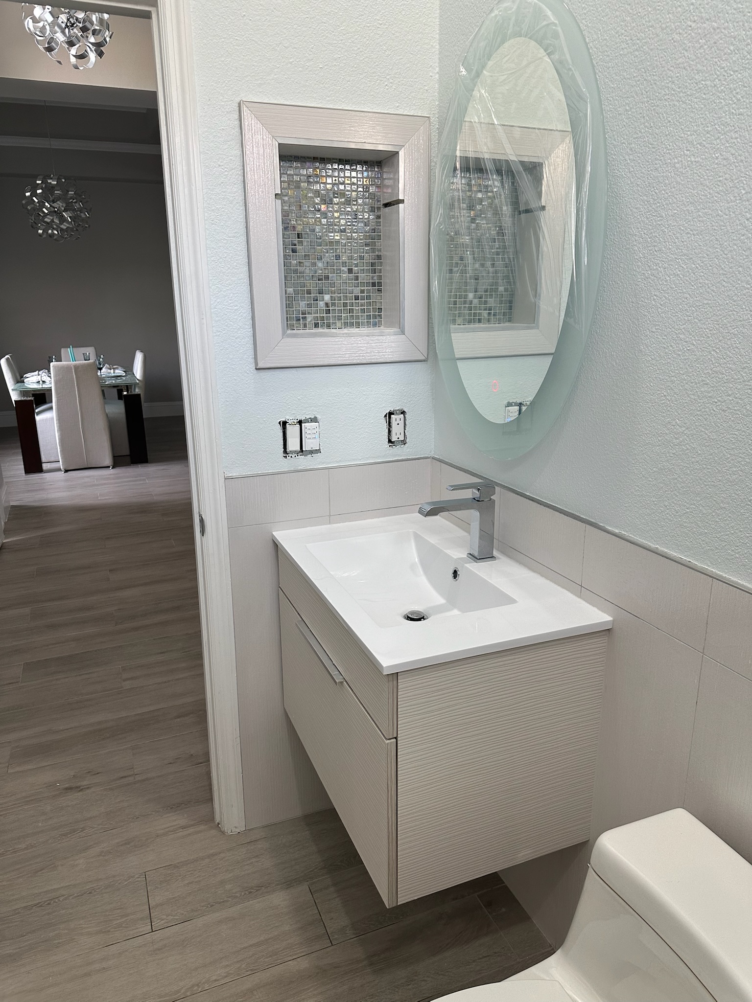 Freestanding Tub and Gray Mosaic Walk-In Shower.