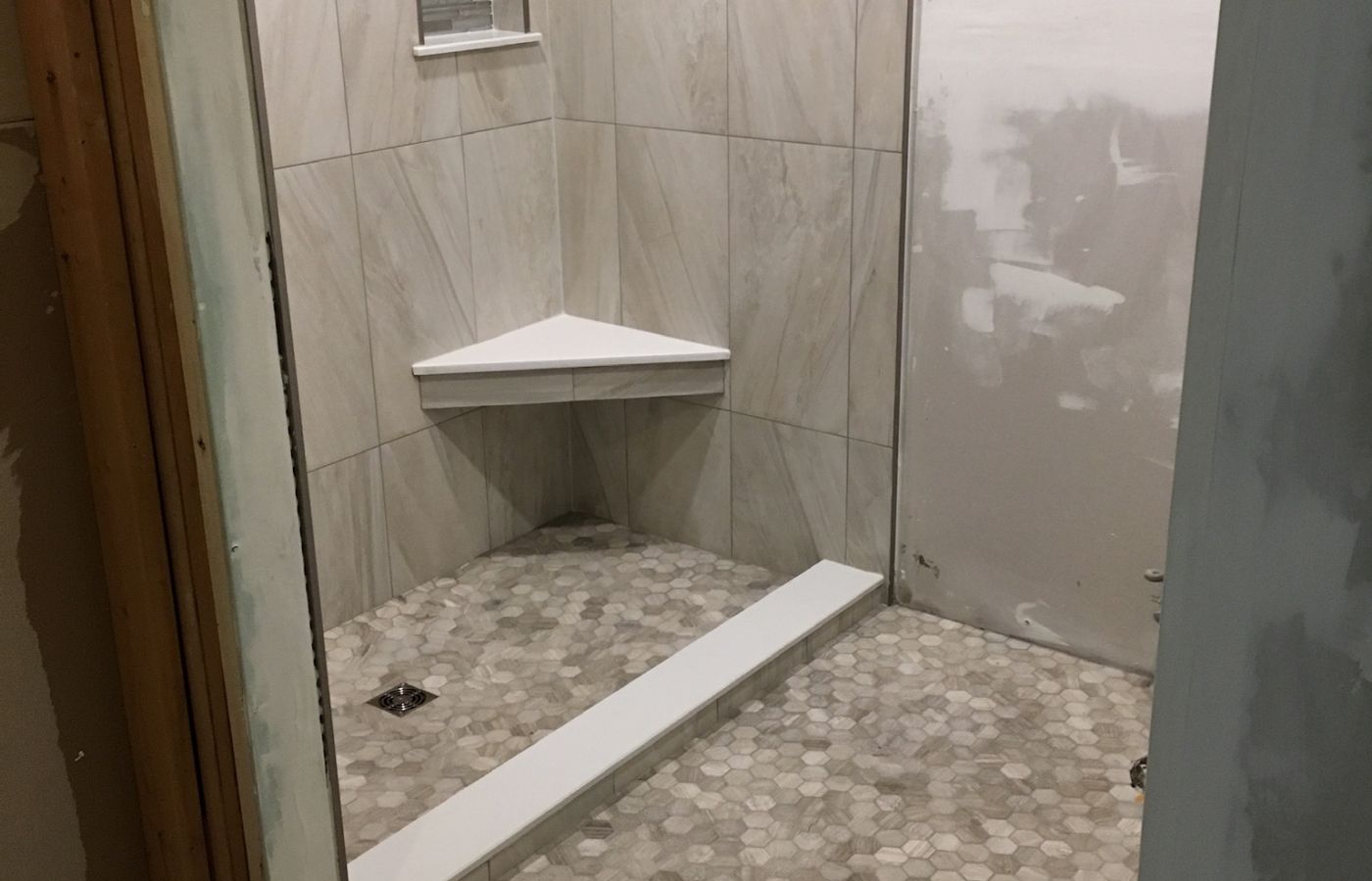Mosaic Bathroom Floor with a Coordinated Shower Accent, project view 1.