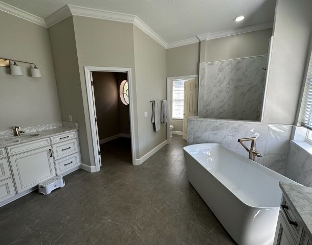 Dark Accent Shower with a Freestanding Tub.