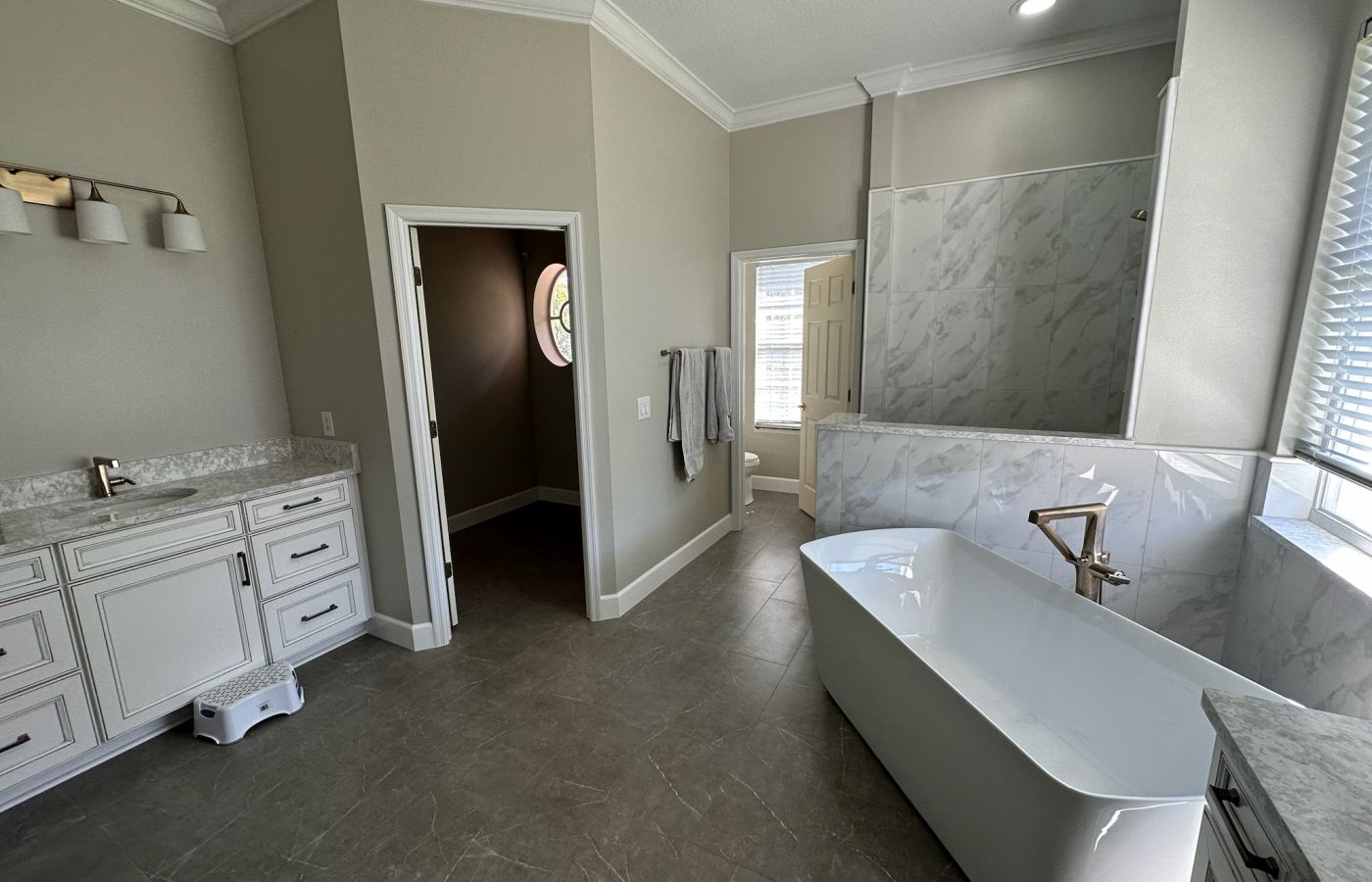 Dark Accent Shower with a Freestanding Tub.